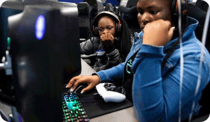 young people gaming with headphones on