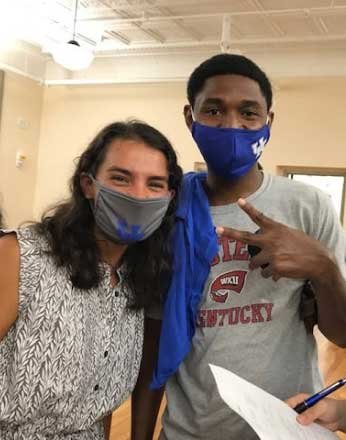 young man and woman wearing fabric masks