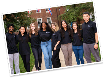 students in black t-shirts pose for a photo